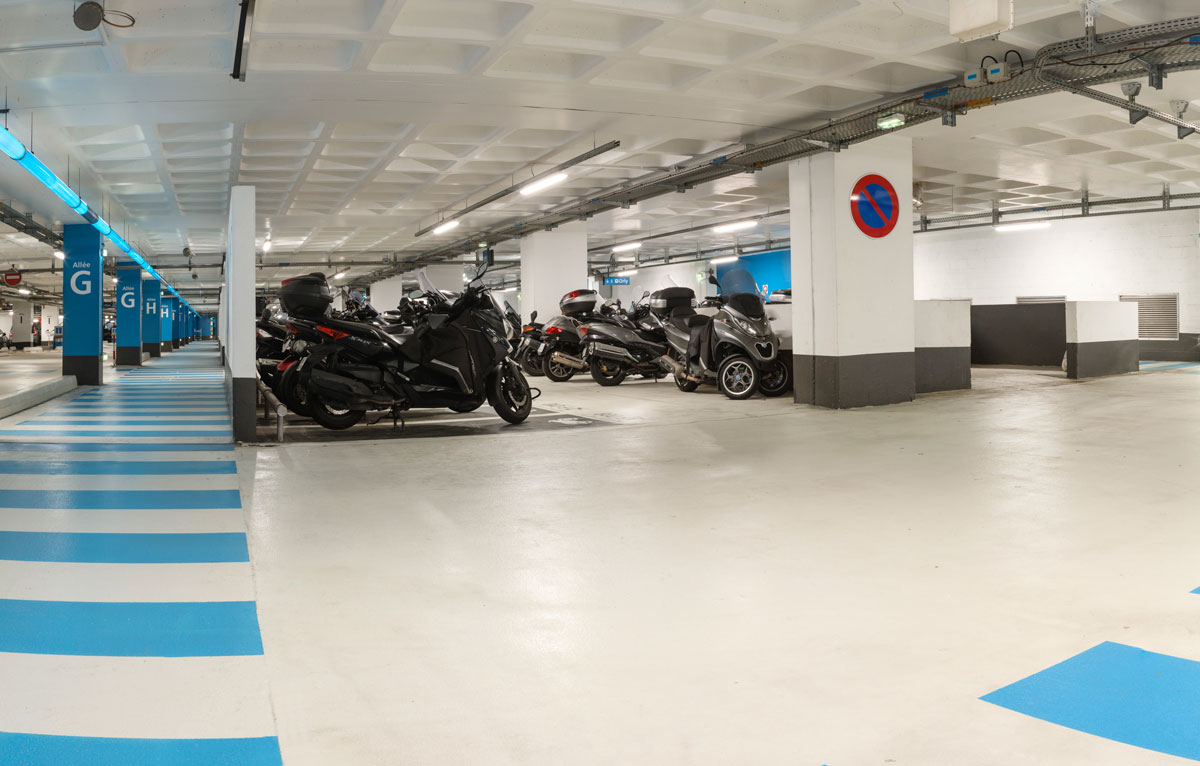 Motorcycles parked in an official Paris Airport parking lot